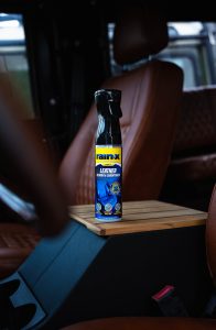 A bottle of Rain-X Leather cleaner in a car